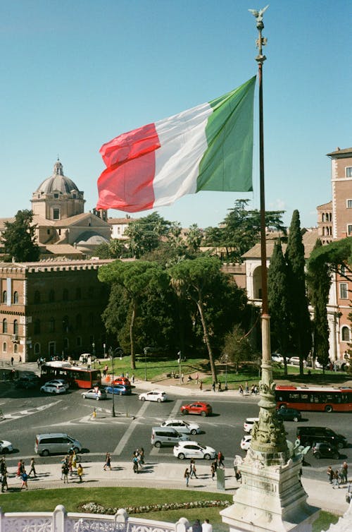 Free Photo Of Cars And People Under Italian Flag Rome Italy 1