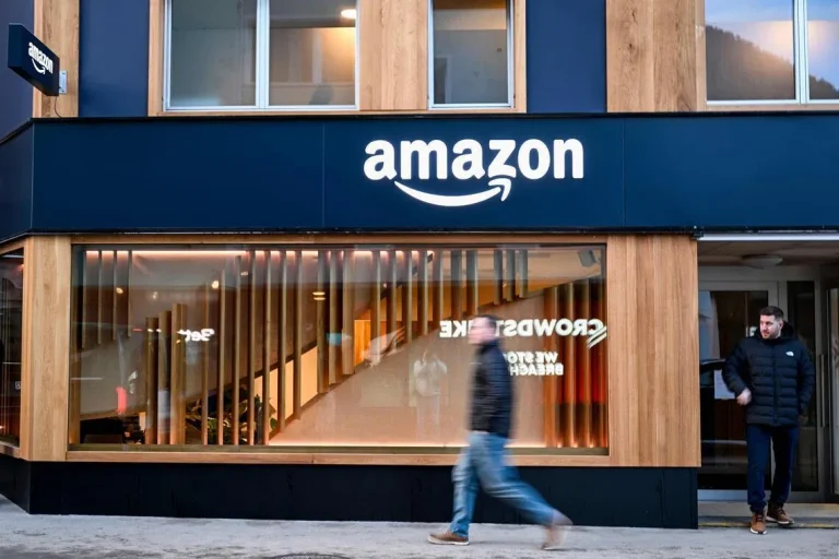 Amazon corporate office with “Job Cuts” overlay illustration