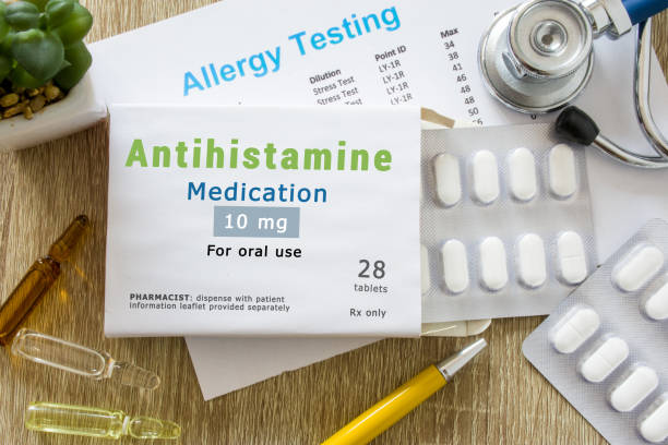 Bottle of diphenhydramine allergy medicine on a pharmacy shelf.